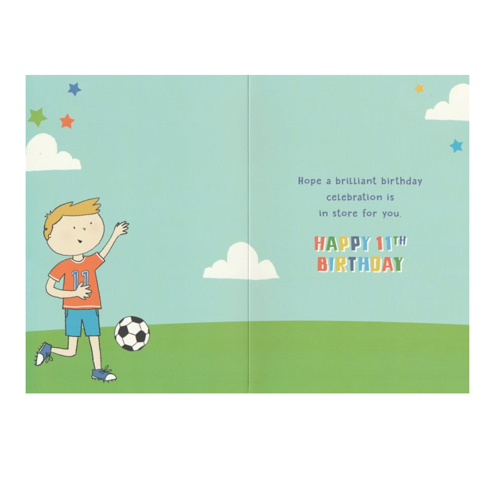 Front of this 11th birthday card features an illustration of a boy scoring a goal, paired with a message.