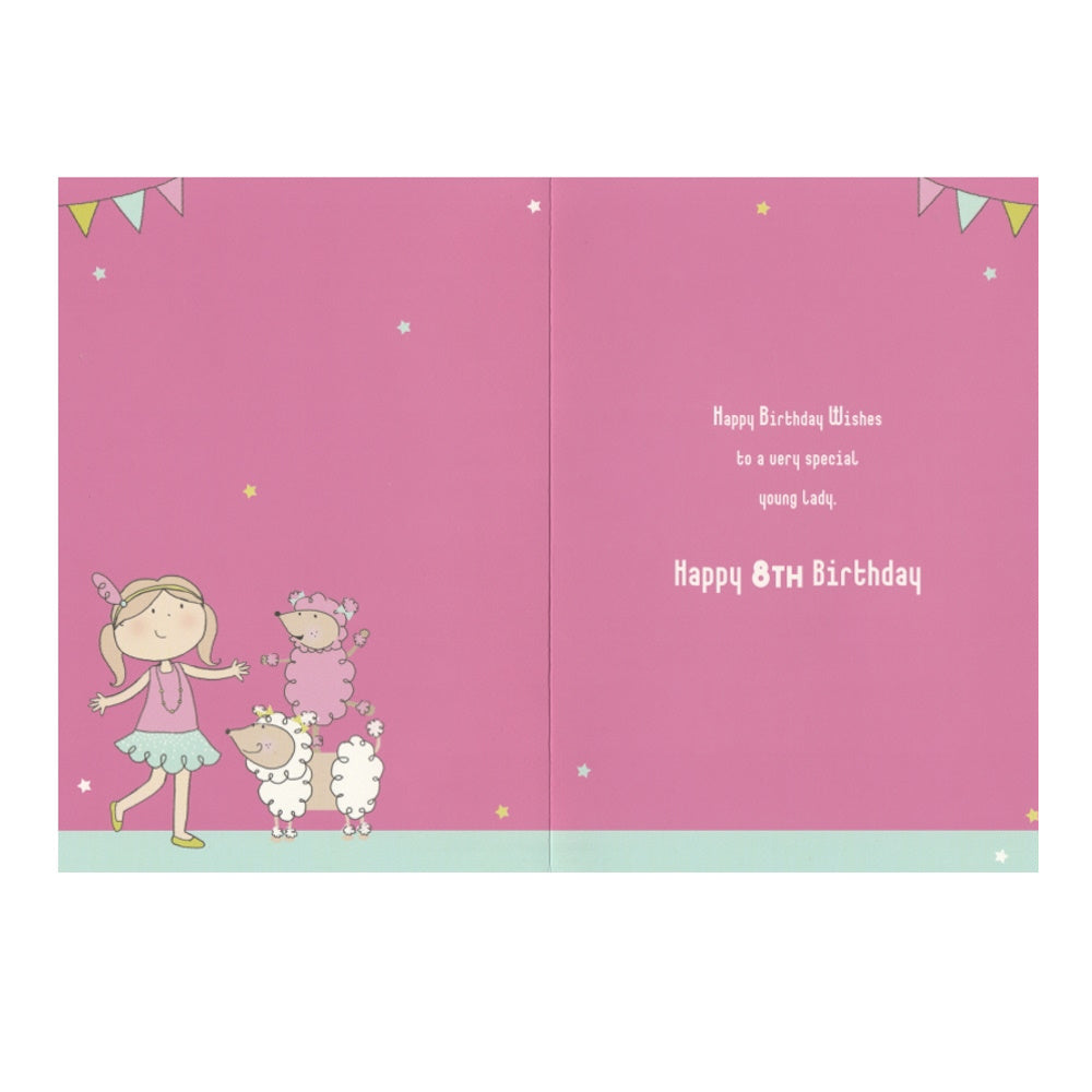 Front of this 8th birthday card features an illustration of a girl with two poodles, paired with a message.