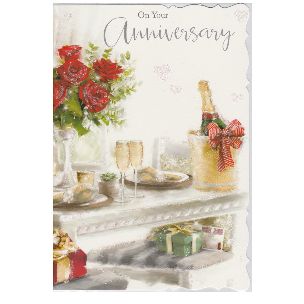 Front of this card features an illustration of a table setting, set with champagne and roses, with the text 'On Your Anniversary'.