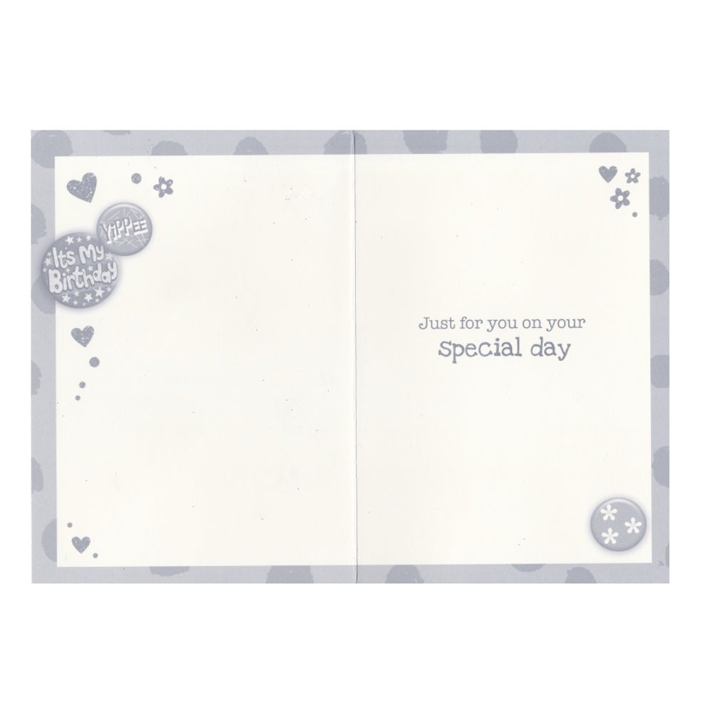 Front of this auntie birthday card features the text 'Happy Birthday Auntie Have a Fun-Filled Day' on a pink patterned background with an illustration of colourful badges, as shown in product photo.