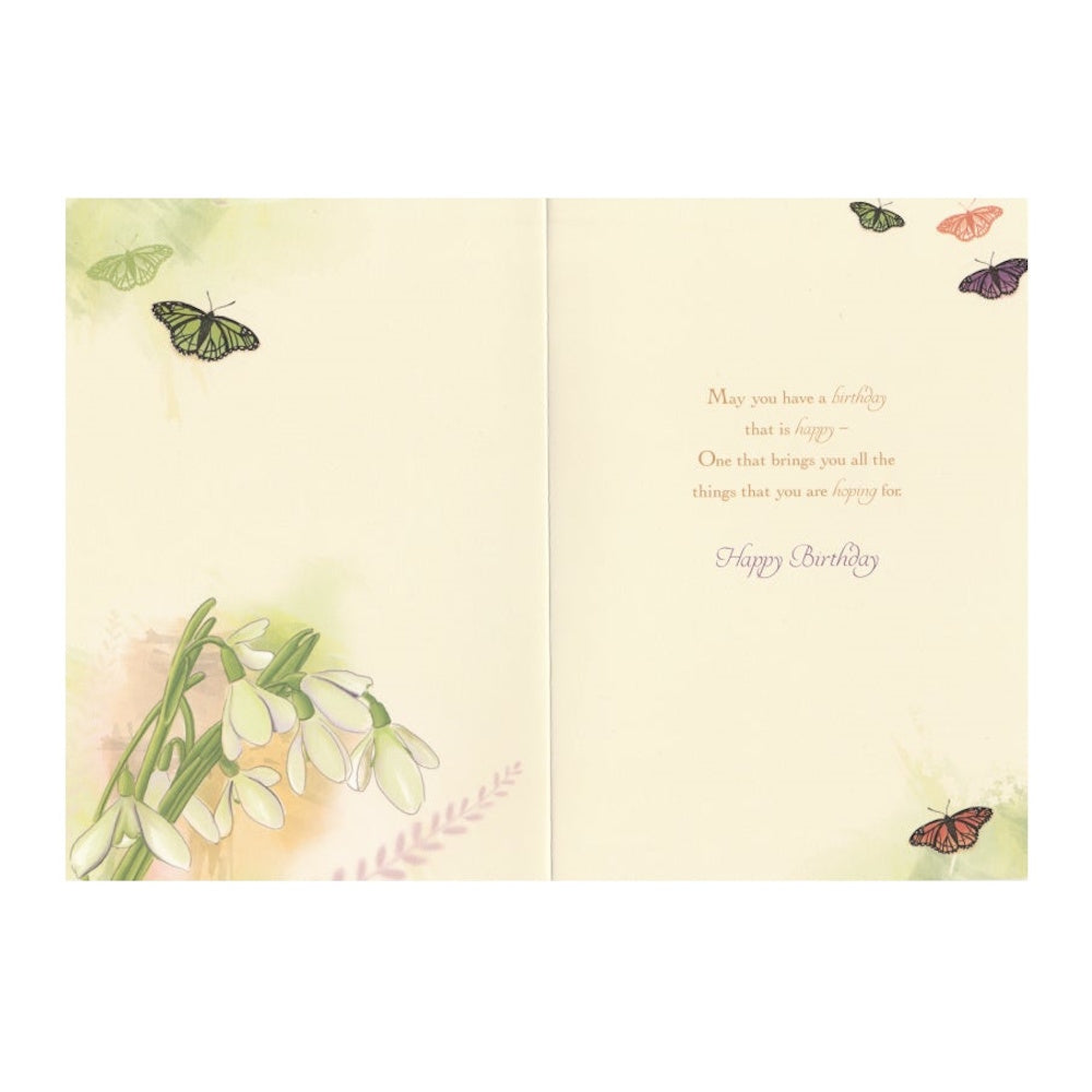 Front of this card features an illustration of snowdrop flowers and a butterfly paired with a message.
