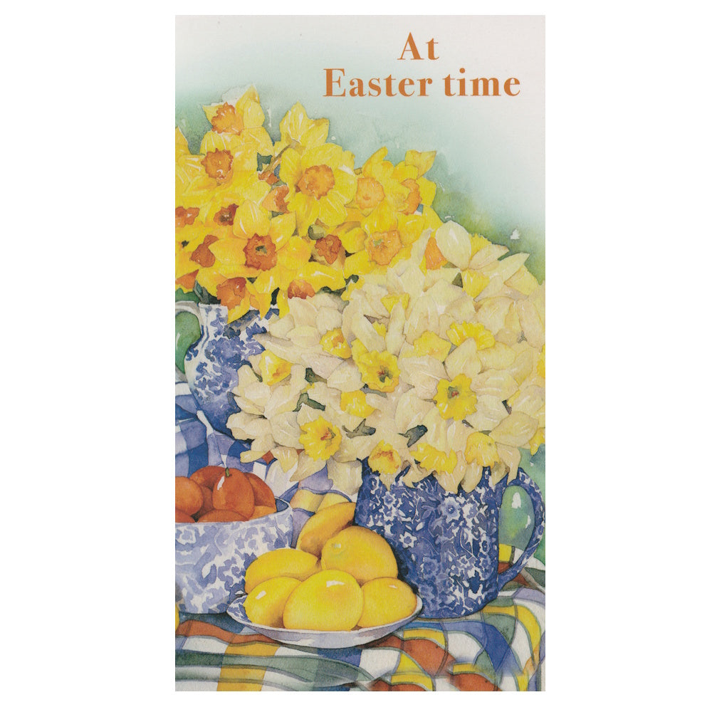 Front of this Easter card features illustrations of colourful flowers and easter eggs with the text 'At easter time'.