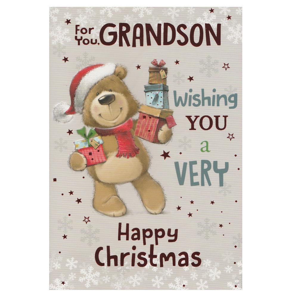 Front of this grandson Christmas card features an illustration of an bear wearing a Christmas hat holding a stack of presents, paired with a message.