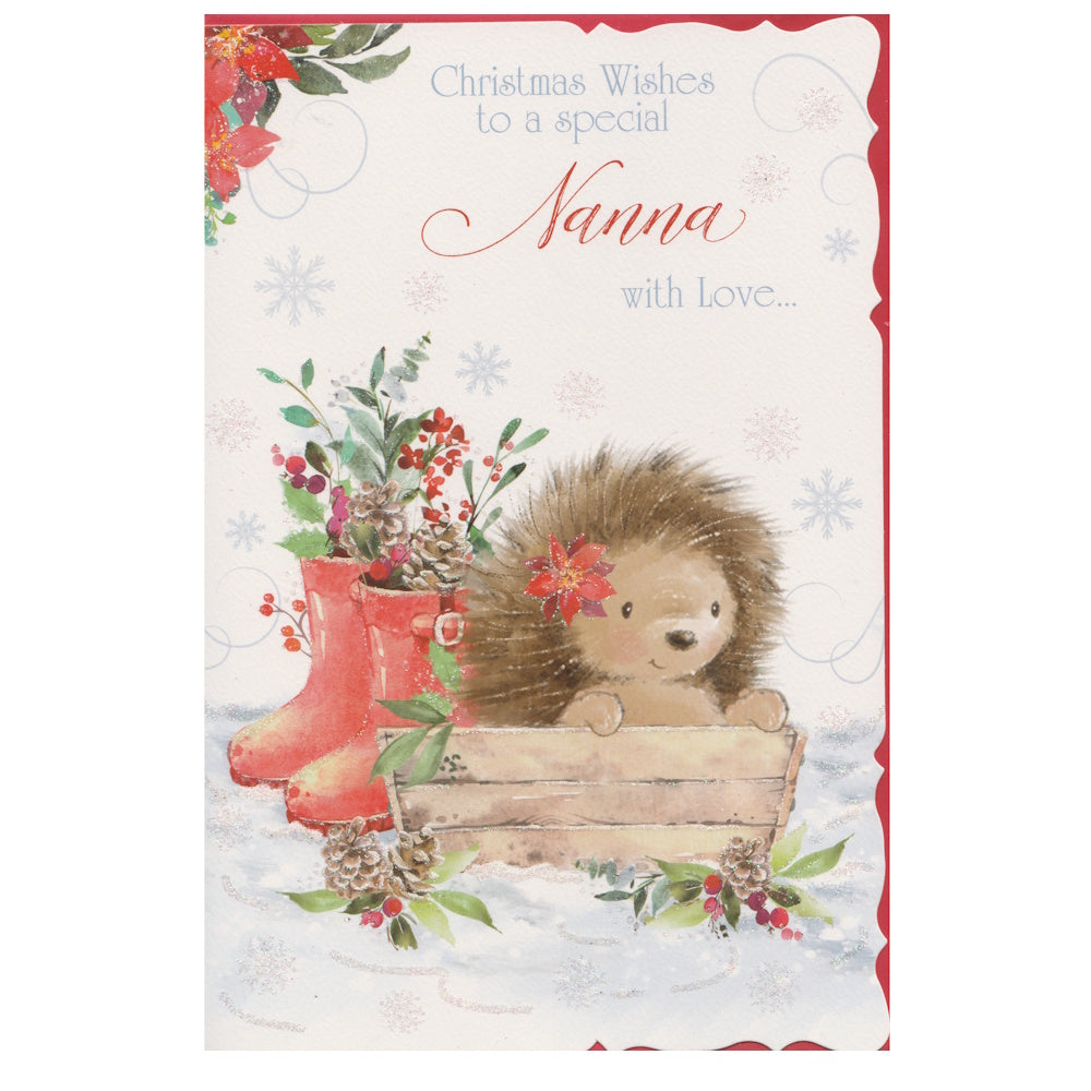 Front of this nanna Christmas card features an illustration of an hedgehog sat in a garden planter with red wellingtons filled with Christmas foliage, paired with a message.