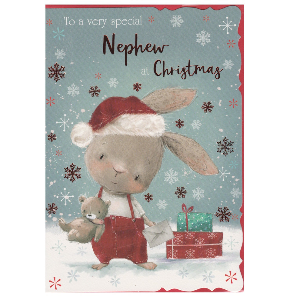 Front of this nephew Christmas card features an illustration of a bunny rabbit holding a teddy bear, surrounded by falling snowflakes, with the text 'To a very special Nephew at Christmas'.