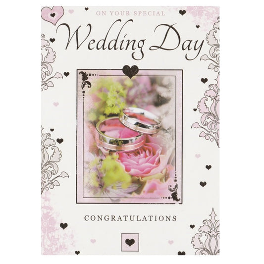 Front of this card features a photo of wedding rings on a background of roses with the text On Your Special Wedding Day Congratulations'.