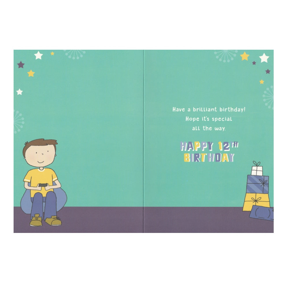 Front of this 12th birthday card  features an illustration of a boy gaming next to a stack of presents, paired with a message.