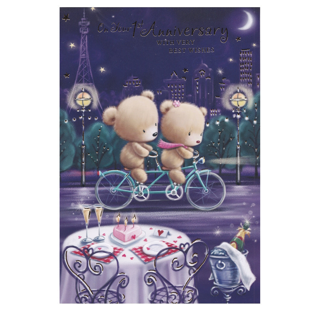 This 1st anniversary card has an illustration of a moonlit Paris scene with two teddy bears cycling passed a table set for an anniversary celebration, paired with a message. Gold foil detail.