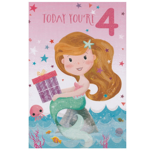 Front of this 4th birthday card features an illustration of a mermaid sat on a rock holding a purple and pink present, paired with a message.