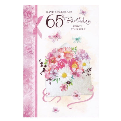 Front of this 65th birthday card features an illustration of a envelope filled with flowers, paired with a message.