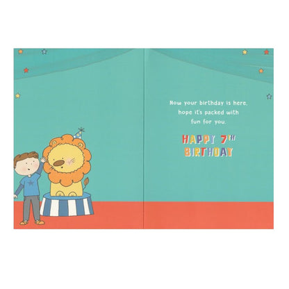 Front of this 7th birthday card features an illustration of a boy with a lion, paired with a message.