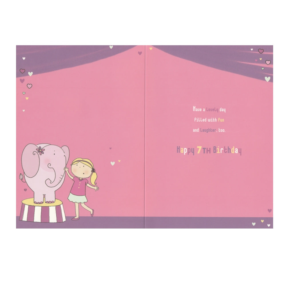 Front of this 7th birthday card features an illustration of a girl with a pink elephant, paired with a message.