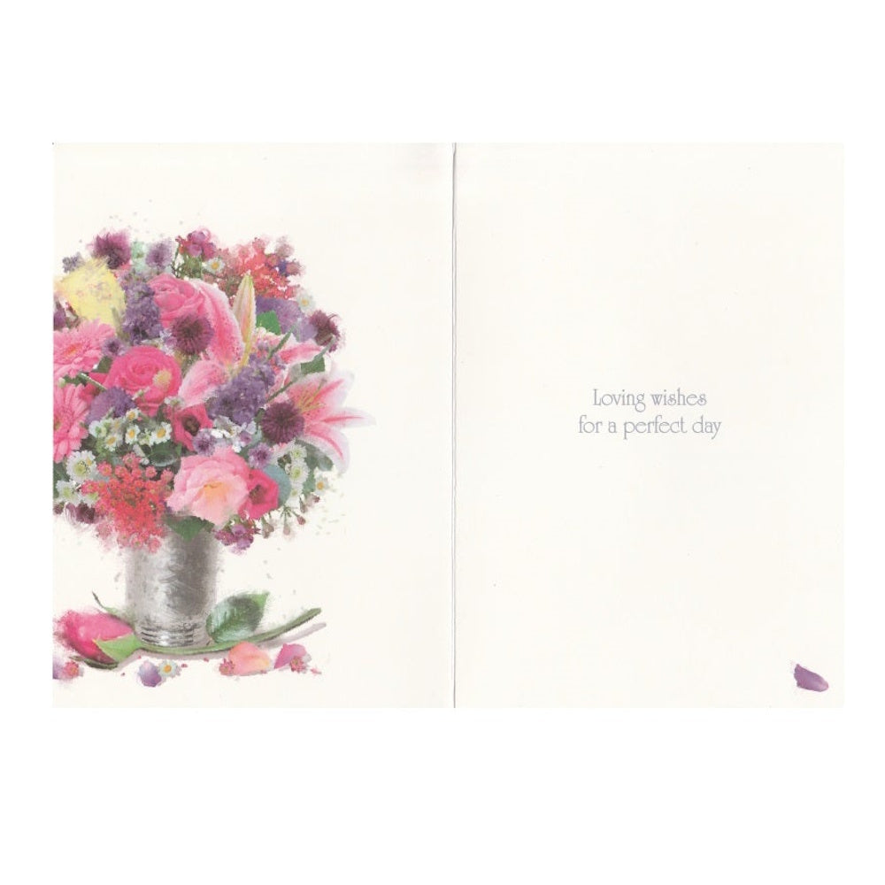 Front of this aunt birthday card features an illustration of a bouquet of colourful flowers in a glass vase, accompanied by a birthday message.