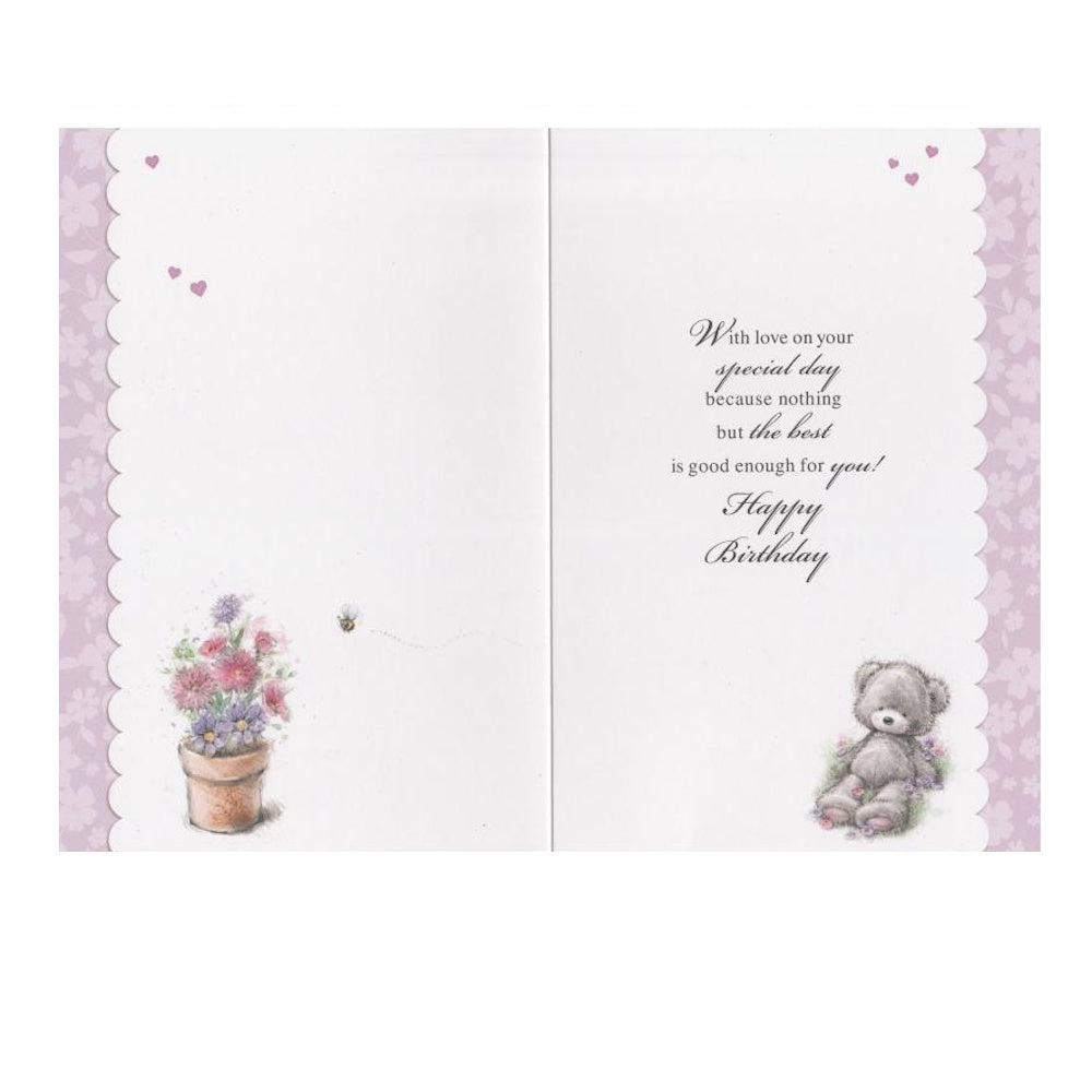 Front of this auntie birthday card features Illustration of a teddy bear sitting next to a flower pot with the text 'For A Fabulous Auntie', as shown in product photo.