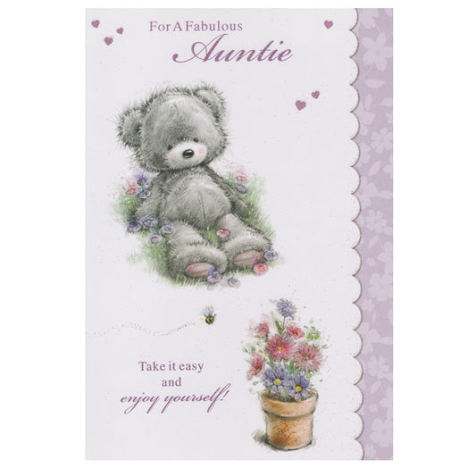 Front of this auntie birthday card features Illustration of a teddy bear sitting next to a flower pot with the text 'For A Fabulous Auntie', as shown in product photo.