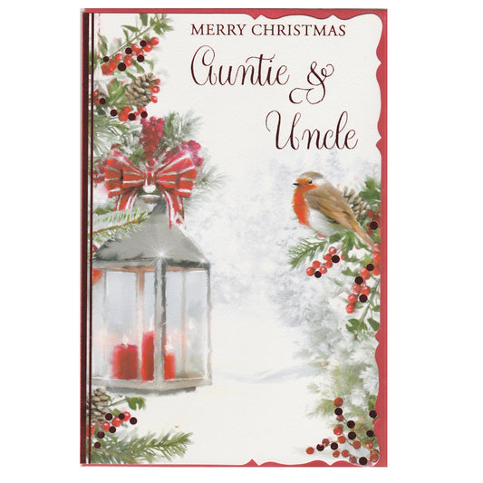 Front of this auntie and uncle Christmas card features an illustration of a Christmas lantern and a robin on a holly branch, paired with a message.