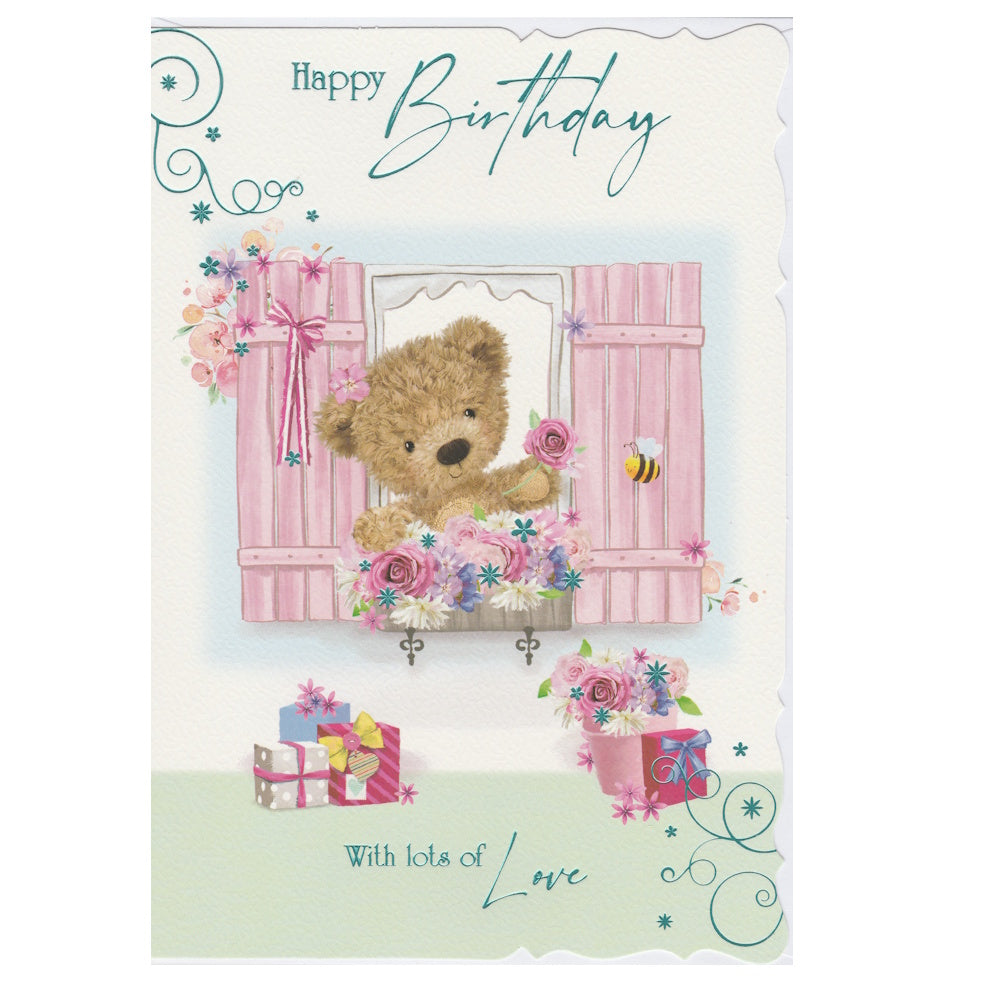Front of this open birthday card features an illustration of a fluffy teddy bear looking of a window with pink shutters, paired with a message.