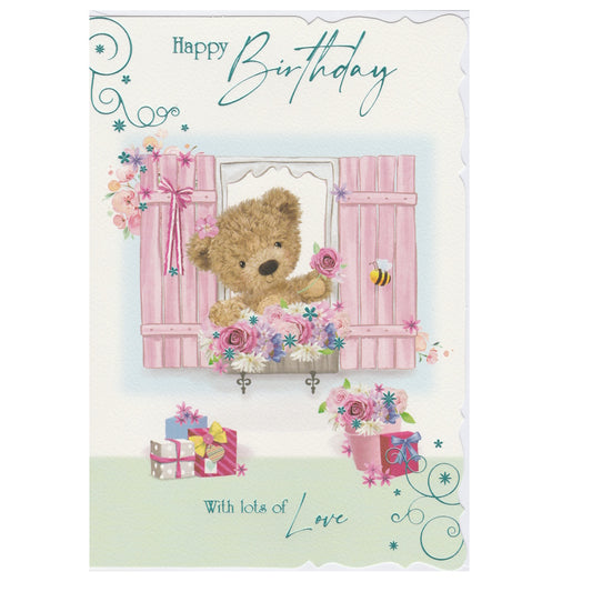 Front of this open birthday card features an illustration of a fluffy teddy bear looking of a window with pink shutters, paired with a message.