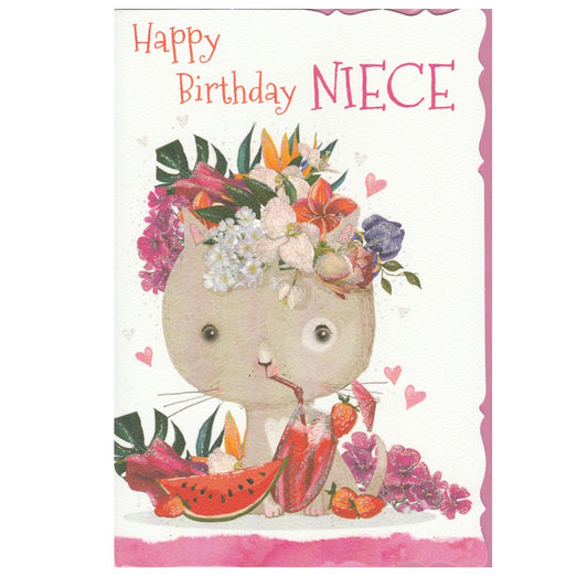 Front of this niece birthday card features an illustration of a cartoon cat wearing a floral crown and surrounded by fruits and flowers, paired with a message.