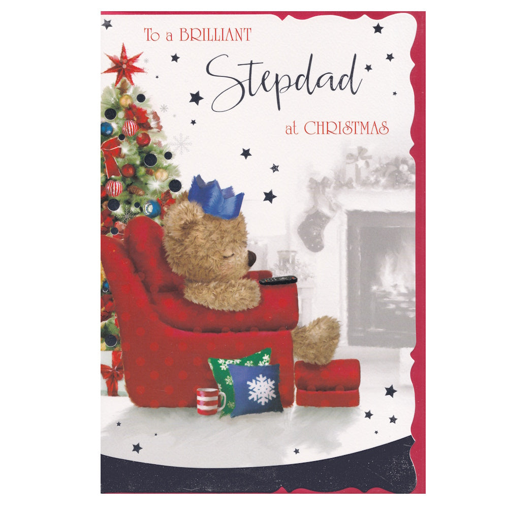 Front of this card features an illustration of a teddy bear asleep in a comfy chair with a decorated Christmas tree and the text 'To a BRILLIANT Stepdad at Christmas'.