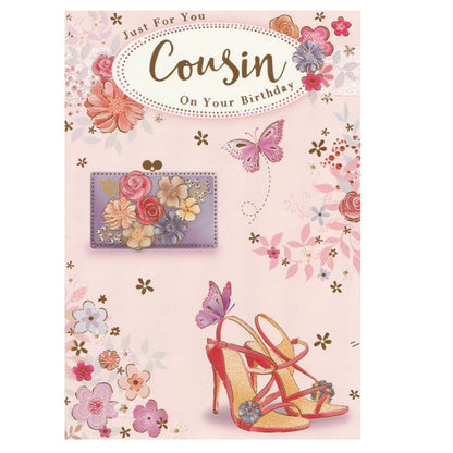 Front of this cousin birthday card features an illustration of a handbag and high heels with a floral background, paired with a message.