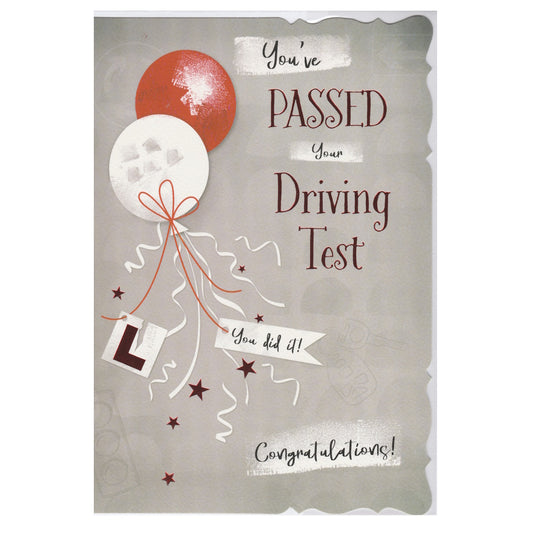 Front of this passed driving test card features an illustration of two balloons and a torn L plate paired with a message.
