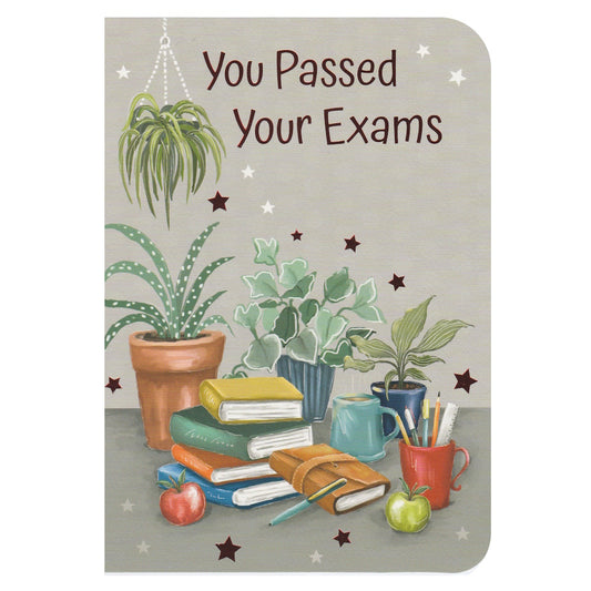 Front of this card features an illustrations of books with plants, stars and stationery on a grey background with 'You Passed Your Exams'.