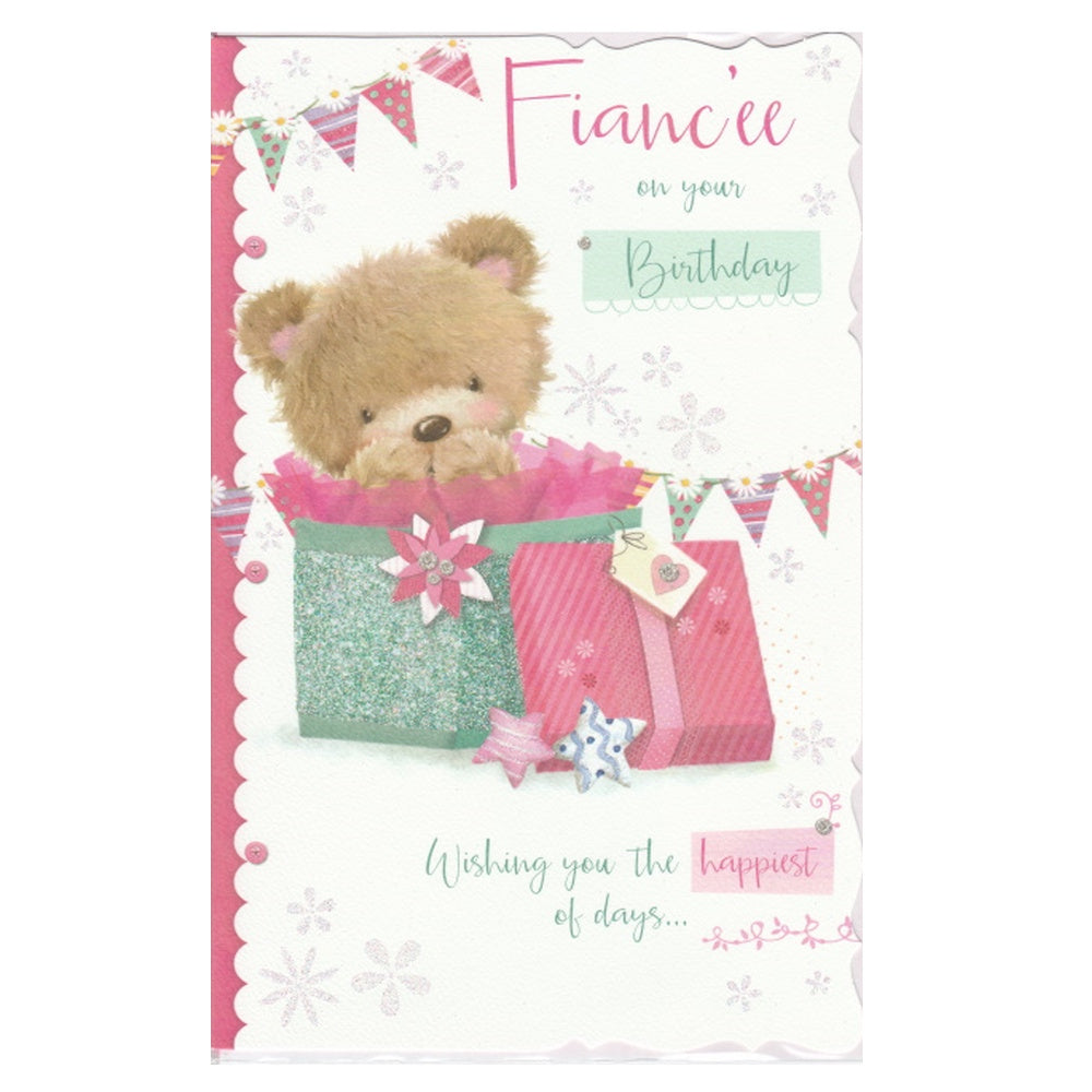 This fiancée birthday card has an illustration of a bear sitting in a gift box with pink tissue paper with bunting and stars detail, paired with a message. Glitter detail.