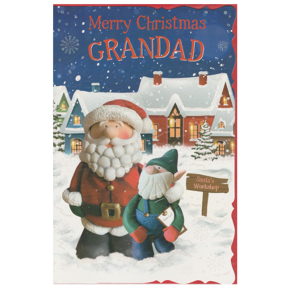 Front of this grandad Christmas card features an illustration of two gnomes one dressed as Father Christmas stood in front of snow topped houses, paired with a message.