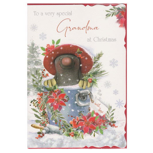 Front of this grandma Christmas card features an illustration of a mole sitting in a bucket, surrounded by Christmas poinsettias, paired with a message.