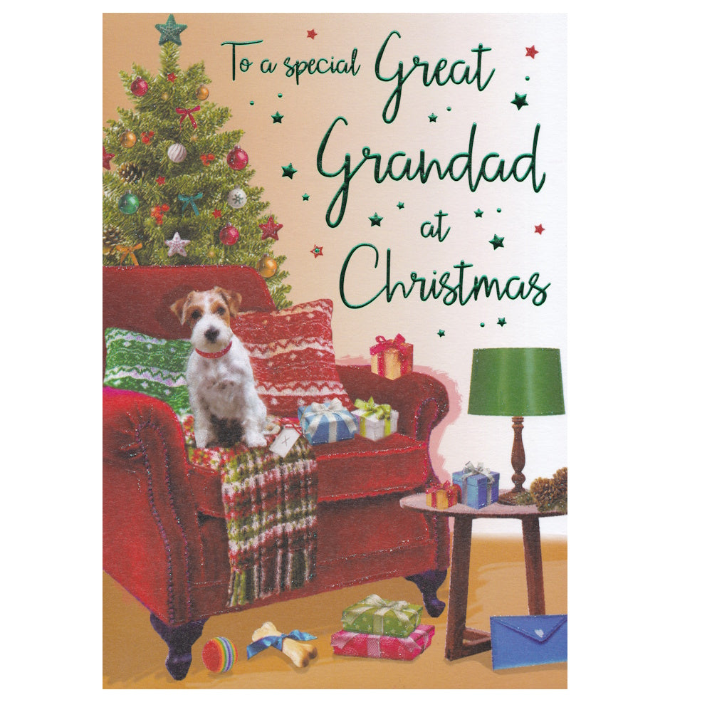 Front of this great grandad Christmas card features an illustration of a Christmas scene with a Jack Russell sat on a red chair with a decorated Christmas tree, paired with a message.