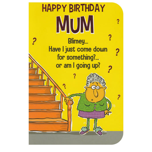 Front of this joke birthday card features a cartoon lady pondering if she has gone up or down the stairs, paired with a message.