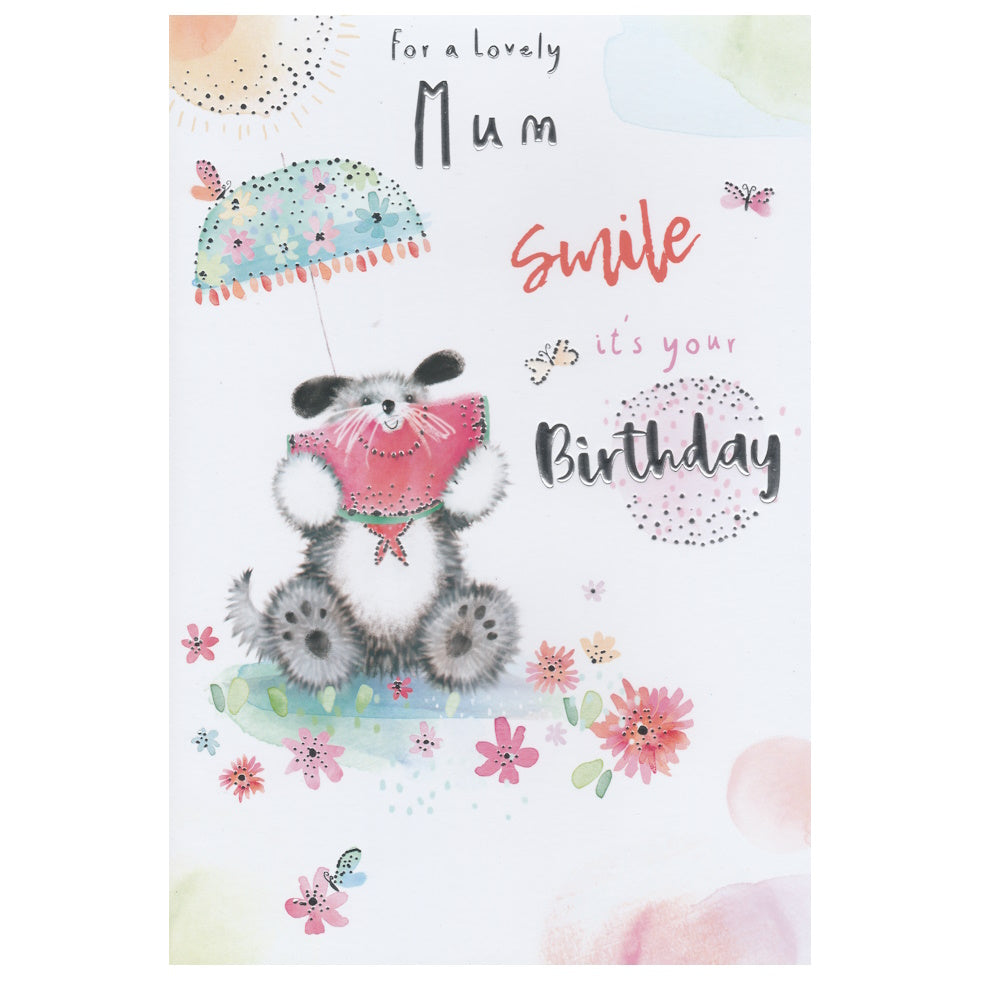 Front of this mum birthday card features a cute illustration of a dog holding a watermelon sitting on a field flowers, paired with a message.