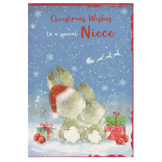 Front of this niece Christmas card features an illustration of two bunnies watching father Christmas flying past in his sleigh, with the text 'Christmas Wishes to a special Niece'.