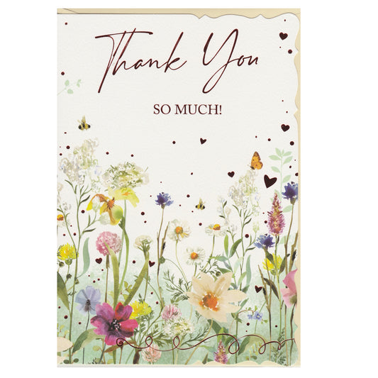 Front of this thank you card features an illustration of a colourful flower meadow, paired with a message.