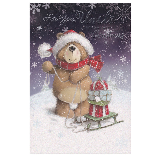This Uncle Christmas card has the text 'For You Uncle Have a Happy Christmas' and an illustration of a teddy bear in a snowy scene with a green sledge filled with Christmas presents. Silver foil detail.