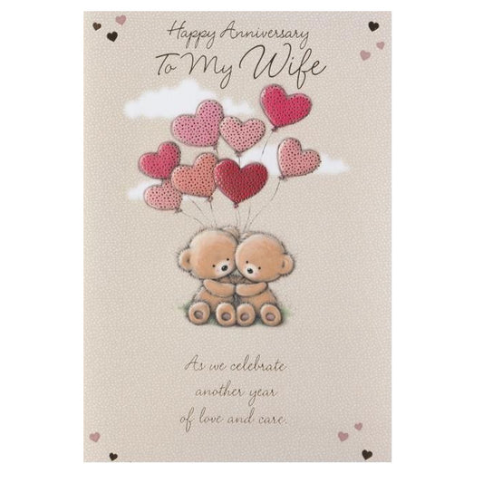 Front of this wife anniversary card features an illustration of two teddy bears holding a bunch of love heart shaped balloons, paired with a message.