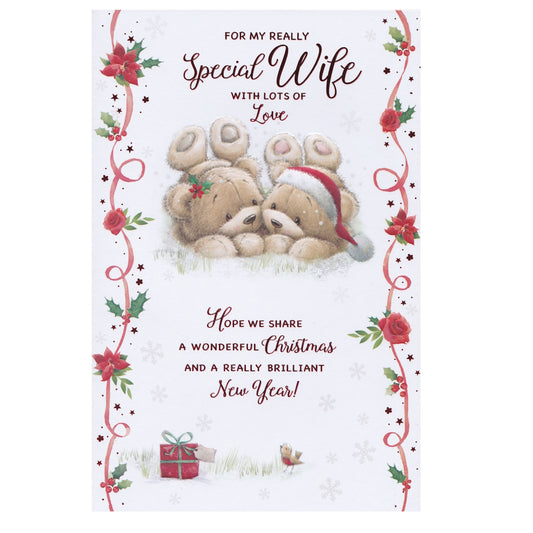 This wife christmas card has an illustration of two teddy bears lying down in the snow with flowers and holly, paired with a message. Red foil detail.
