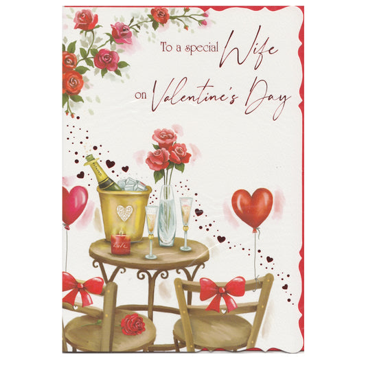 This wife valentine's day card has an illustration of a table set for valentine's day decorated with love hearts and bows with the text 'To a special Wife on Valentine's Day'. Red foil detail.